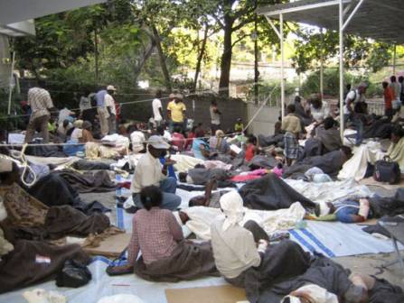 Haiti earthquake victims receiving treatment in the 
courtyard of the MSF compound