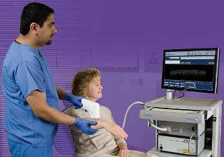 VivoSight OCT scanner with hand-held probe being used to investigate sub-surface skin tissue