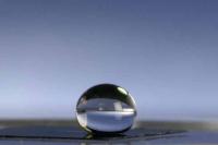 A drop of water balances perfectly on a film of plastic nanofibres.