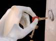 The i-LIMB hand with skin holding a key